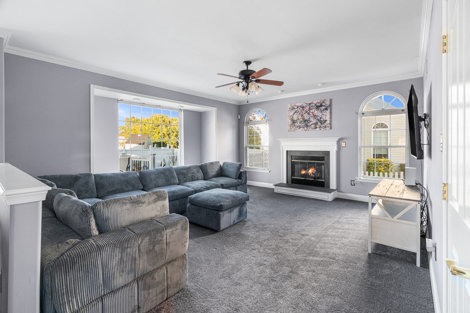 Living room with a large sectional sofa and fireplace
